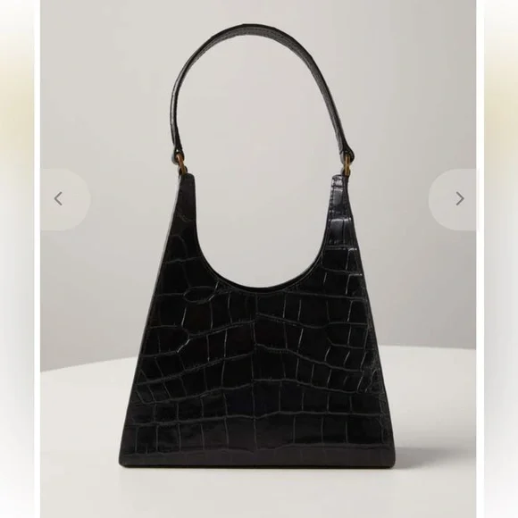 The STAUD Rey Bag in black is a triangular leather bag featuring a top handle - Picture 1 of 5